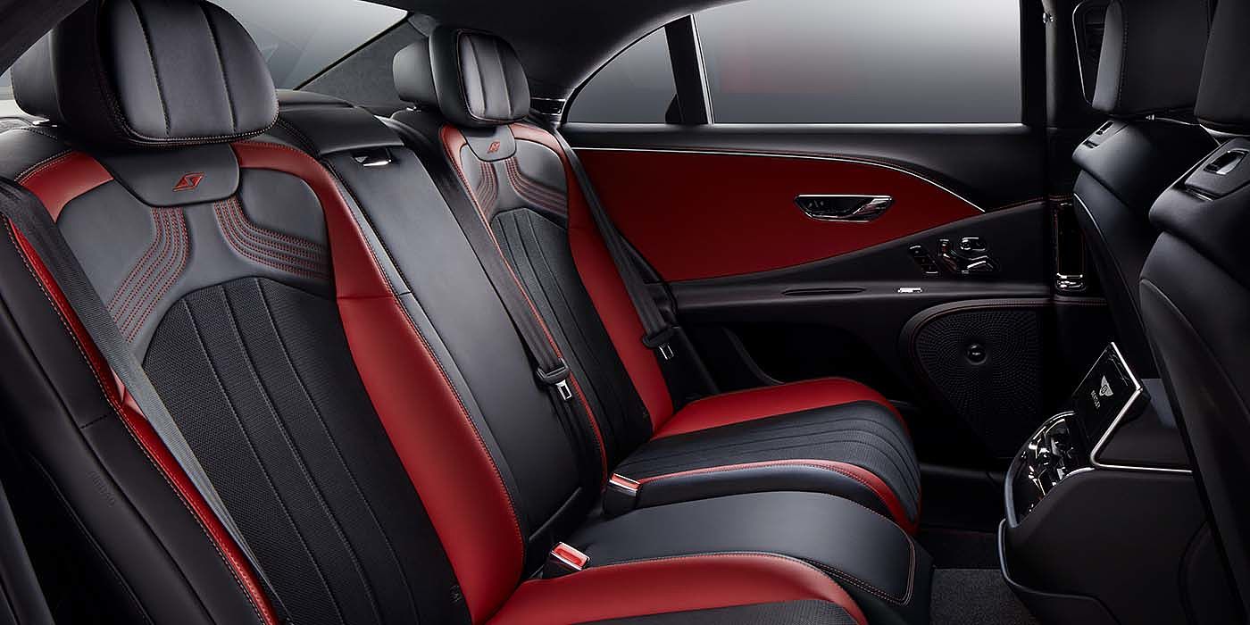 Bentley Manila Bentley Flying Spur S sedan rear interior in Beluga black and Hotspur red hide with S stitching