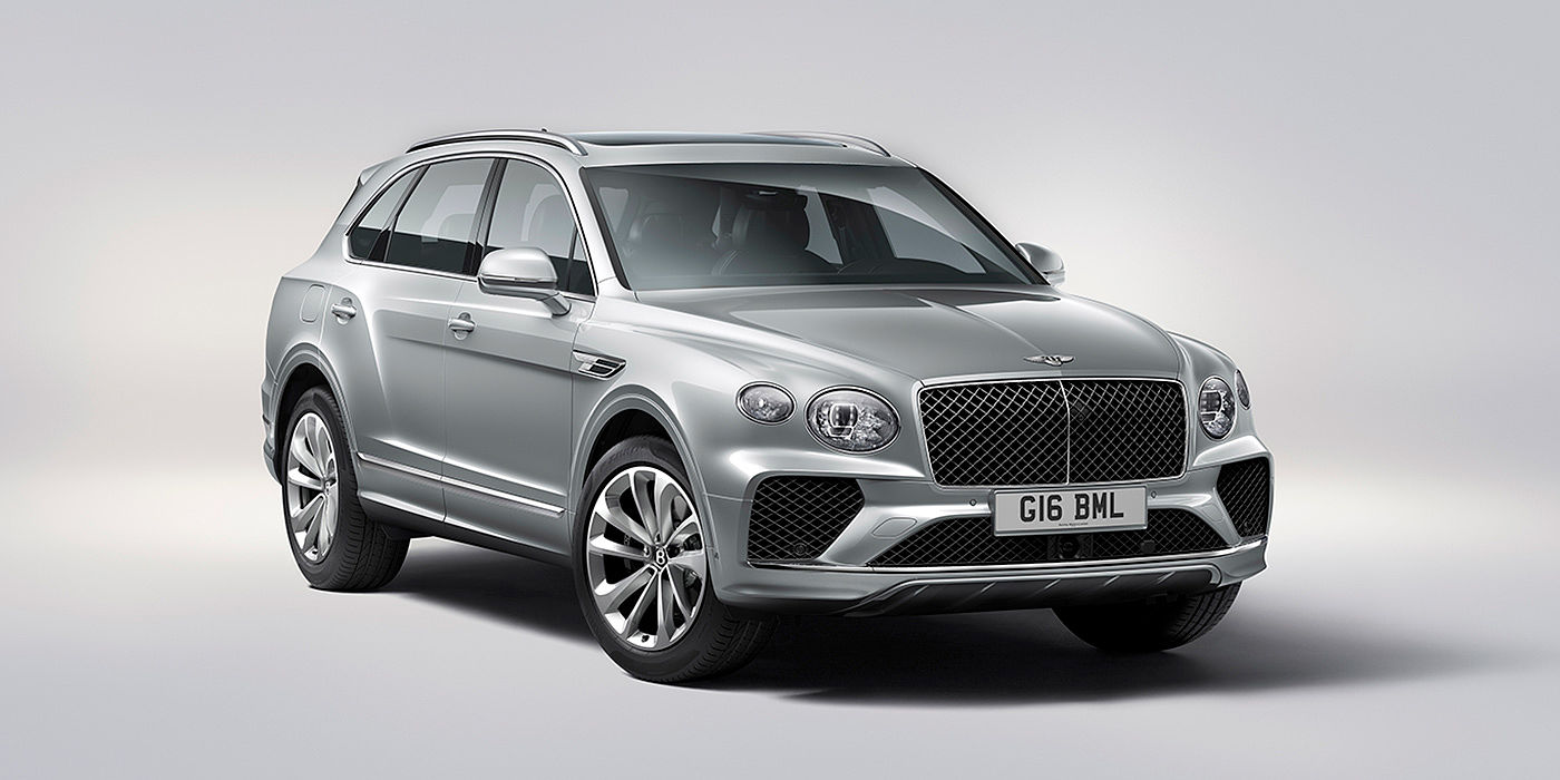 Bentley Manila Bentley Bentayga in Moonbeam paint, front three-quarter view, featuring a matrix grille and elliptical LED headlights.