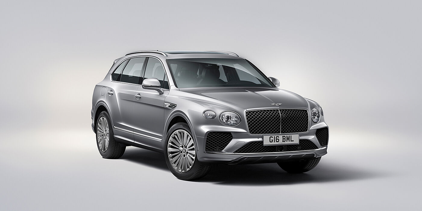 Bentley Manila Bentley Bentayga luxury SUV front three quarter view in Moonbeam paint with matrix grille and 21″ 5 spoke painted wheels