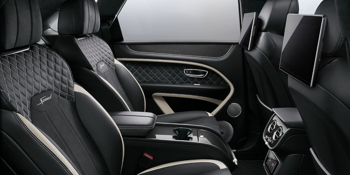 Bentley Manila Bentley Bentayga Speed SUV rear interior in Beluga black and Linen hide with carbon fibre veneer