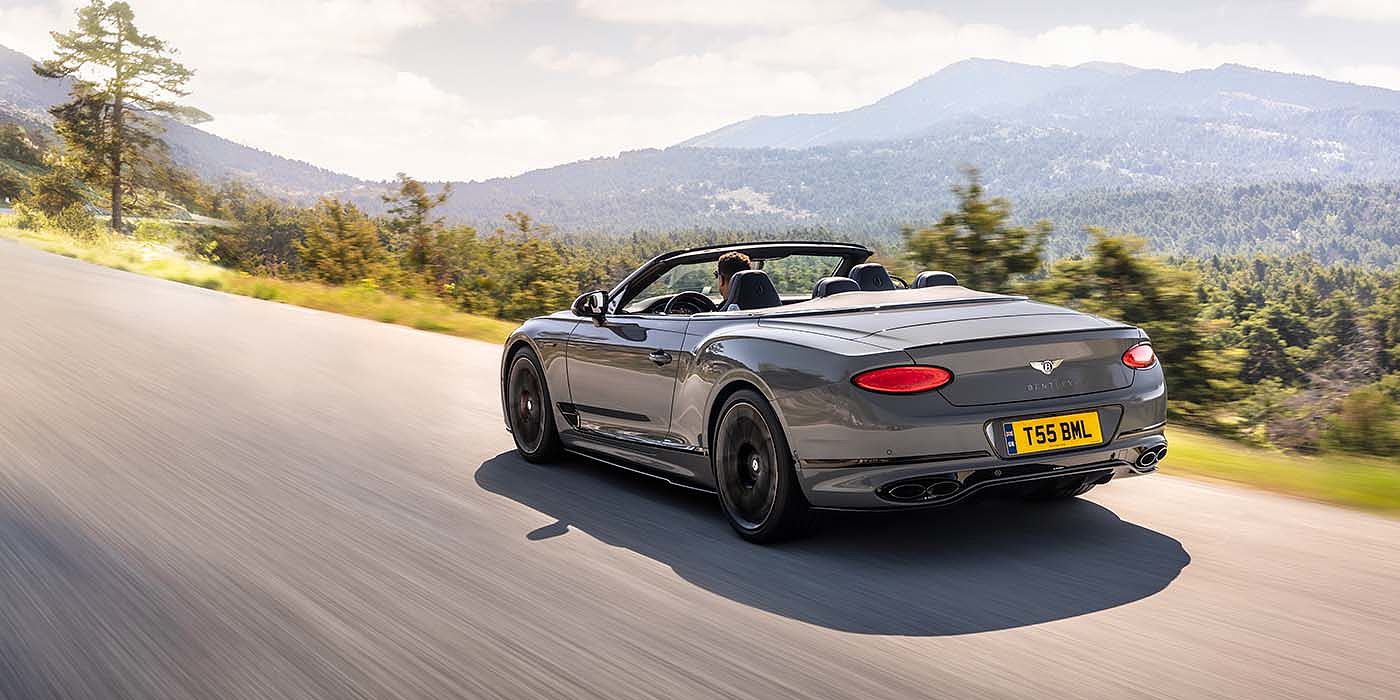 Bentley Manila Bentley Continental GTC S convertible in Cambrian Grey paint rear 34 dynamic driving