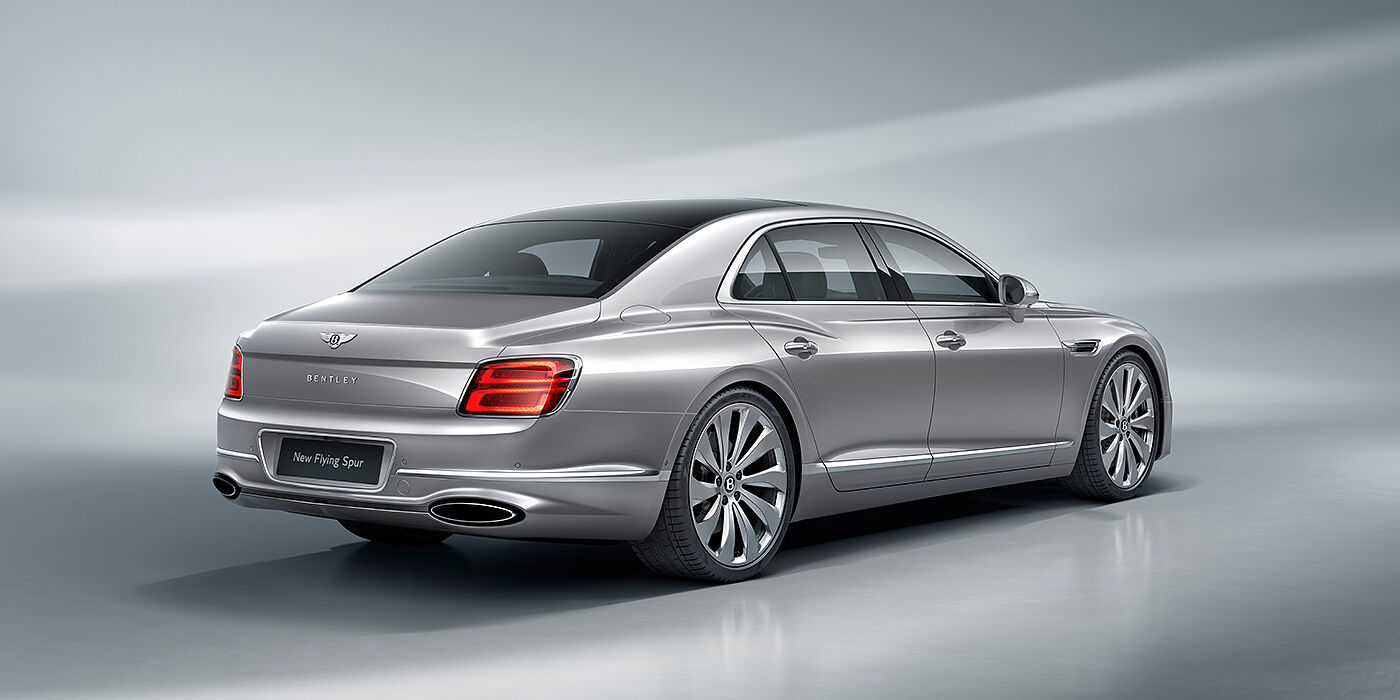 Bentley Manila New Bentley Flying Spur sedan rear view in Silverlake paint with ten spoke wheels and chrome matrix grille