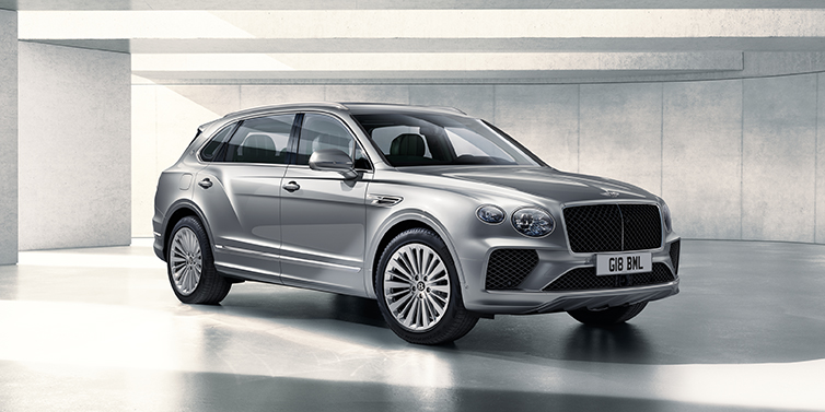 Bentley Manila Bentley Bentayga Extended Wheelbase SUV front three quarter in Moonbeam paint with a grey background