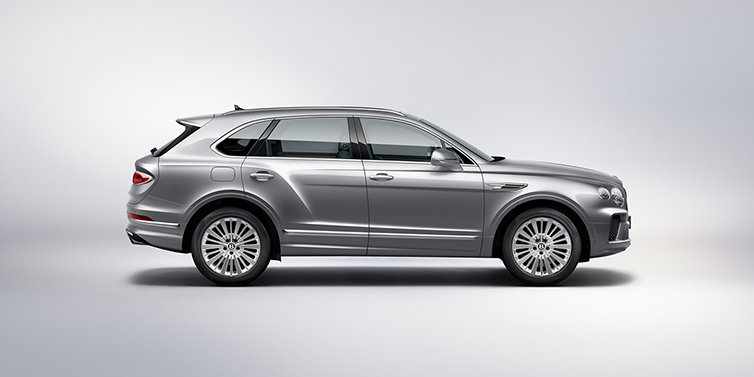 Bentley Manila Bentley Bentayga SUV side profile in Moonbeam silver paint against white background featuring 21 inch 5 spoke wheels