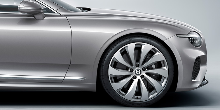 Bentley Manila New Bentley Continental GT coupe side view featuring bonnet in Silverlake paint and 22 inch ten spoke silver painted and bright machined wheel