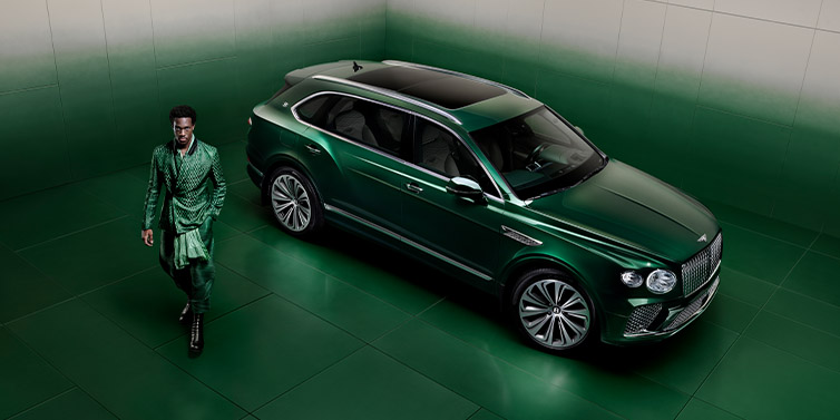 Bentley Manila Wisdom K standing next to Bentley Bentayga Extended Wheelbase SUV in Light Emerald green paint seen from overhead