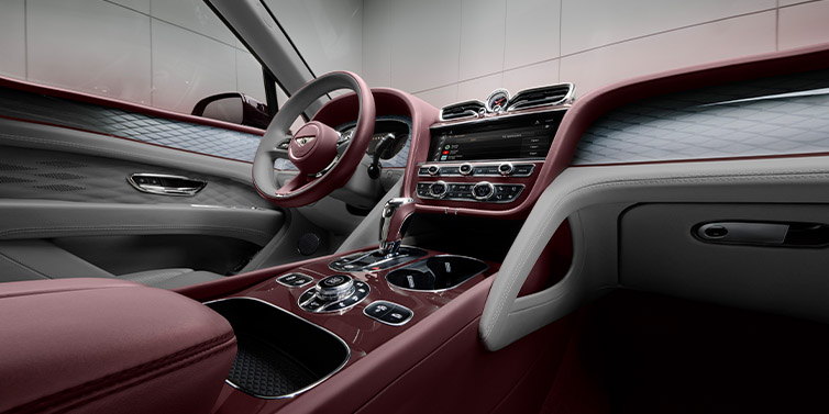 Bentley Manila Bentley Bentayga Extended Wheelbase SUV front interior in Gravity Gray and Cricket Ball red hides with Dark Tint Diamond Brushed Aluminium veneer