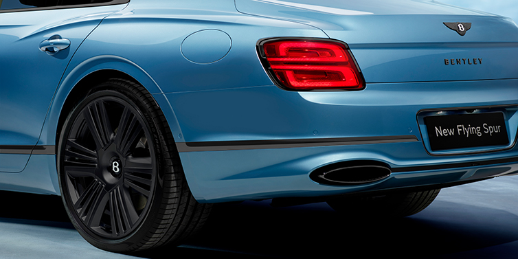 Bentley Manila New Bentley Flying Spur Azure sedan in Light windsor blue by Mulliner paint and Black Specification, showing 22 inch Black Azure wheel, black exhaust pipes and exterior features