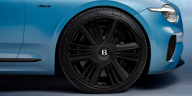 Bentley Manila New Bentley Continental GTC Azure convertible front wheel detail with 22 inch black ten spoke wheel and dark chrome details against Light Windsor blue paint