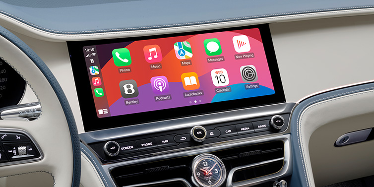 Bentley Manila New Bentley Flying Spur Azure sedan front cabin central MMI screen showing available services against Linen and Brunel hides and Piano Linen veneer